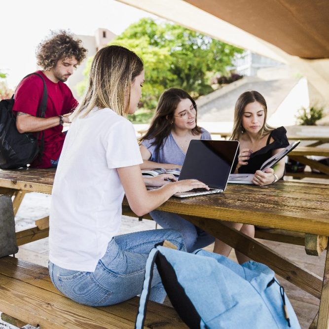 students-studying-table-park